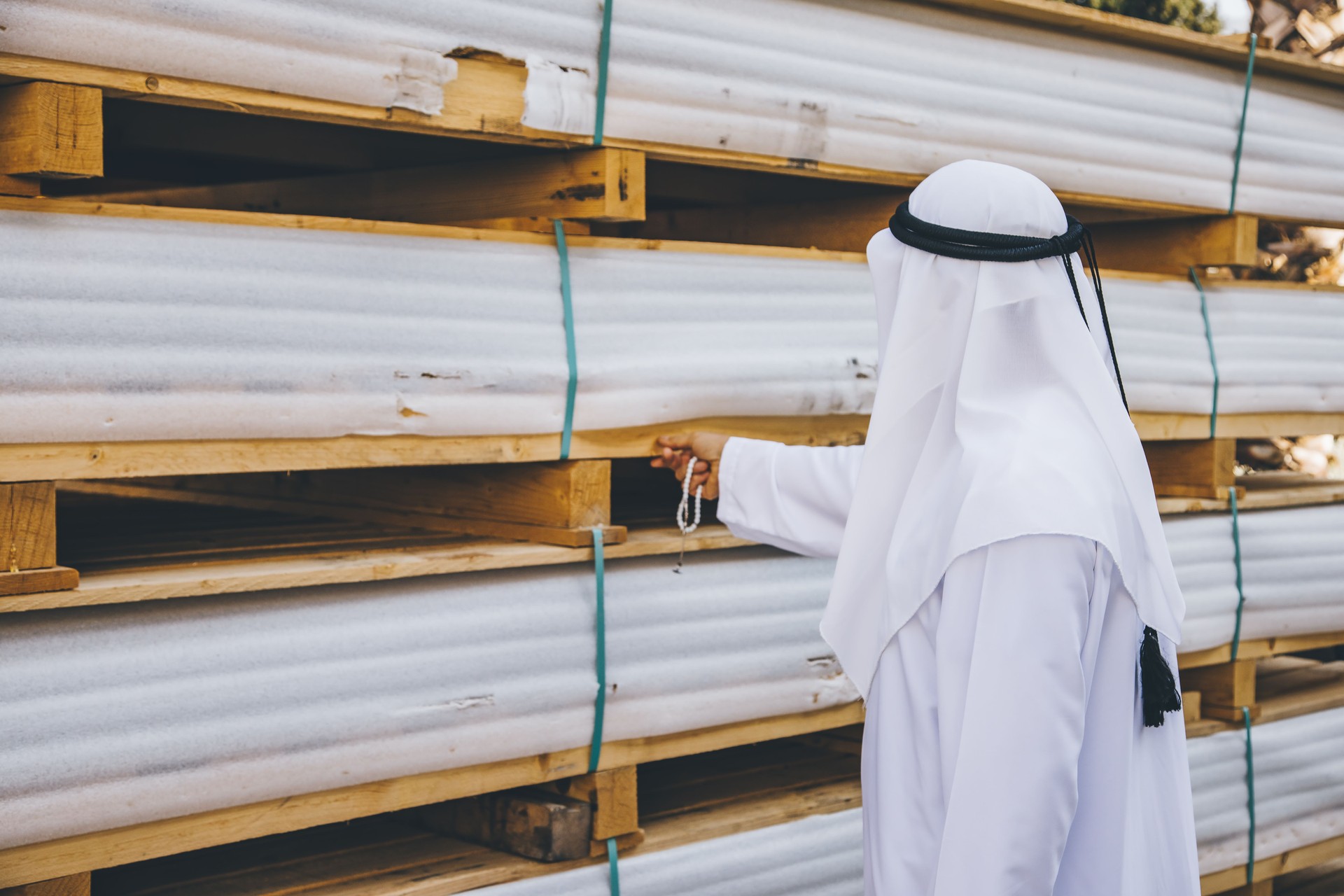Arab businessman checking the quality of the products
